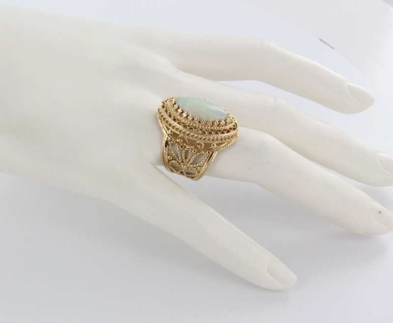 Vintage 14 Karat Yellow Gold Opal Cigar Cocktail Ring Fine Estate Jewelry Pre-Owned Vintage 14 Karat Yellow Gold Opal Cigar Cocktail Ring Fine Estate Jewelry Pre-Owned