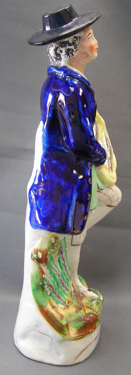 Early 19th Century Staffordshire Figure of A Fish Vendor Early 19th Century Staffordshire Figure of A Fish Vendor