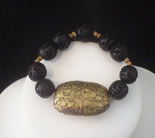 Tibetan Repousse Brass and Carved Resin Bracelet Tibetan Repousse Brass and Carved Resin Bracelet