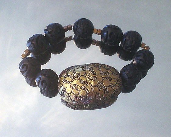 Tibetan Repousse Brass and Carved Resin Bracelet Tibetan Repousse Brass and Carved Resin Bracelet