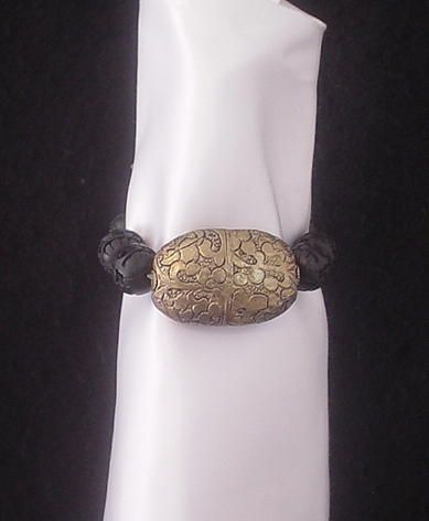 Tibetan Repousse Brass and Carved Resin Bracelet Tibetan Repousse Brass and Carved Resin Bracelet