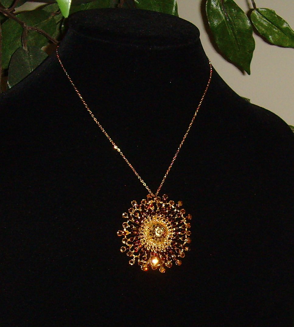 Gold-Tone and Rhinestone Sunburst Pendant Gold-Tone and Rhinestone Sunburst Pendant