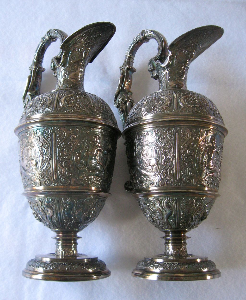 Antique Elkington highly embossed silver plate ewers, pair, 1850s Antique Elkington highly embossed silver plate ewers, pair, 1850s