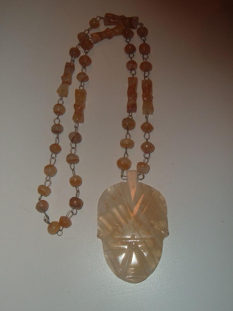 Incredible Beaded Stone Necklace and Carved Pendant Incredible Beaded Stone Necklace and Carved Pendant