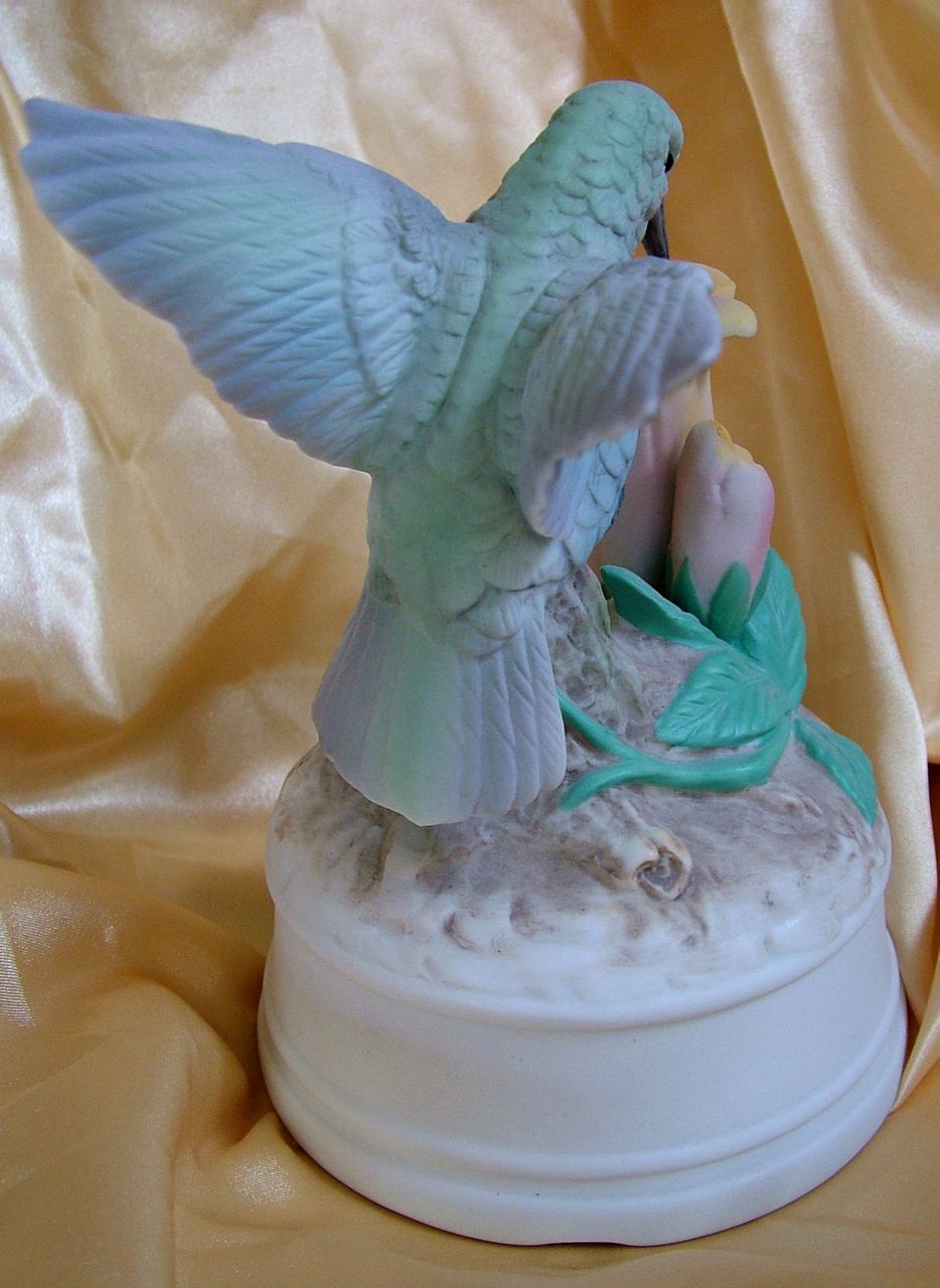 Music box figure hummingbird on trumpet flower pastel colors Music box figure hummingbird on trumpet flower pastel colors