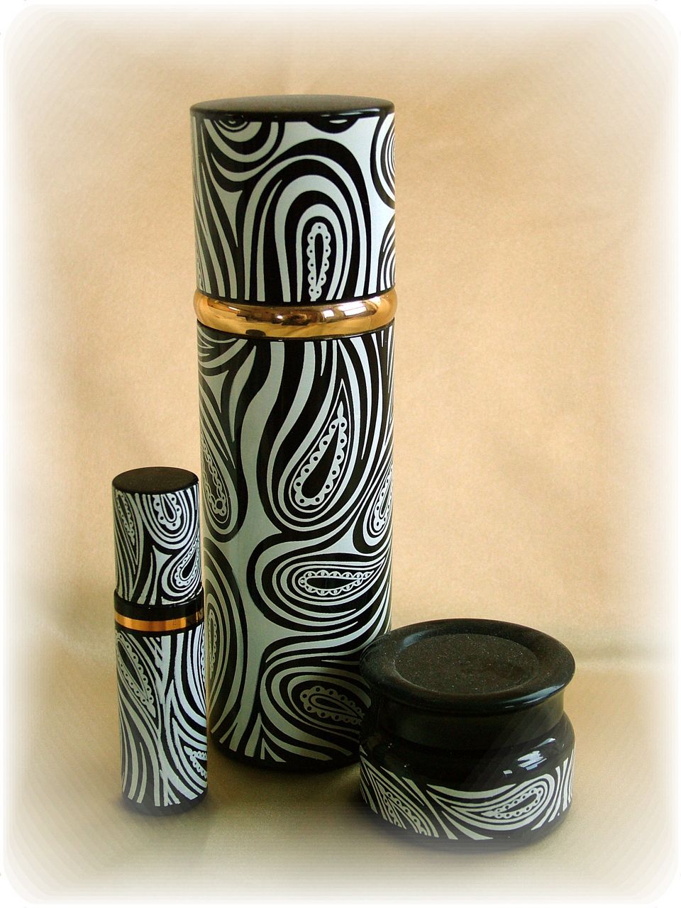 Set of vintage black and white paisley cologne bottles Set of vintage black and white paisley cologne bottles