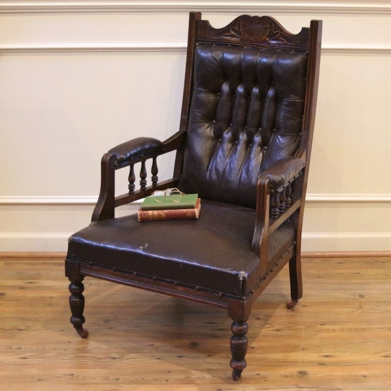 Antique Arm Chair, English Carved Walnut, Leather Button Back Side. Antique Arm Chair, English Carved Walnut, Leather Button Back Side.