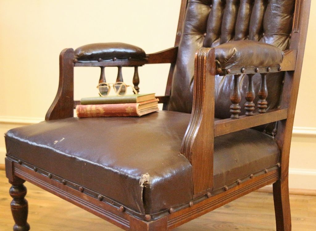 Antique Arm Chair, English Carved Walnut, Leather Button Back Side. Antique Arm Chair, English Carved Walnut, Leather Button Back Side.