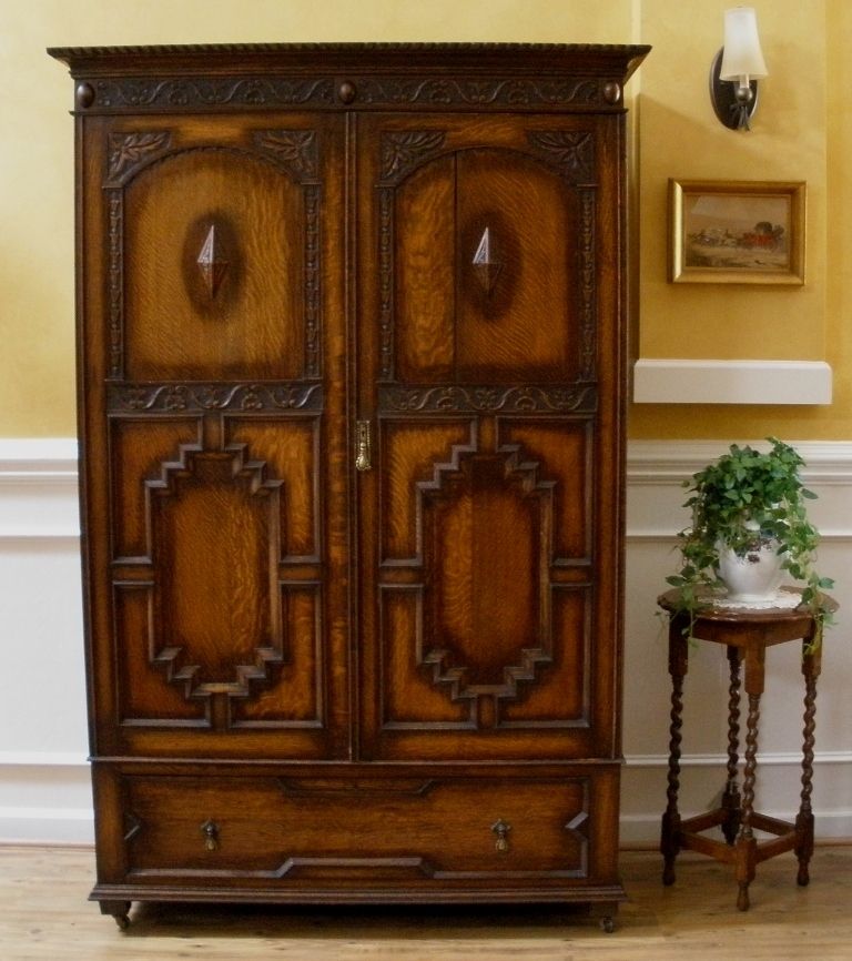 Antique English Carved Oak Jacobean Style Wardrobe Armoire. Antique English Carved Oak Jacobean Style Wardrobe Armoire.