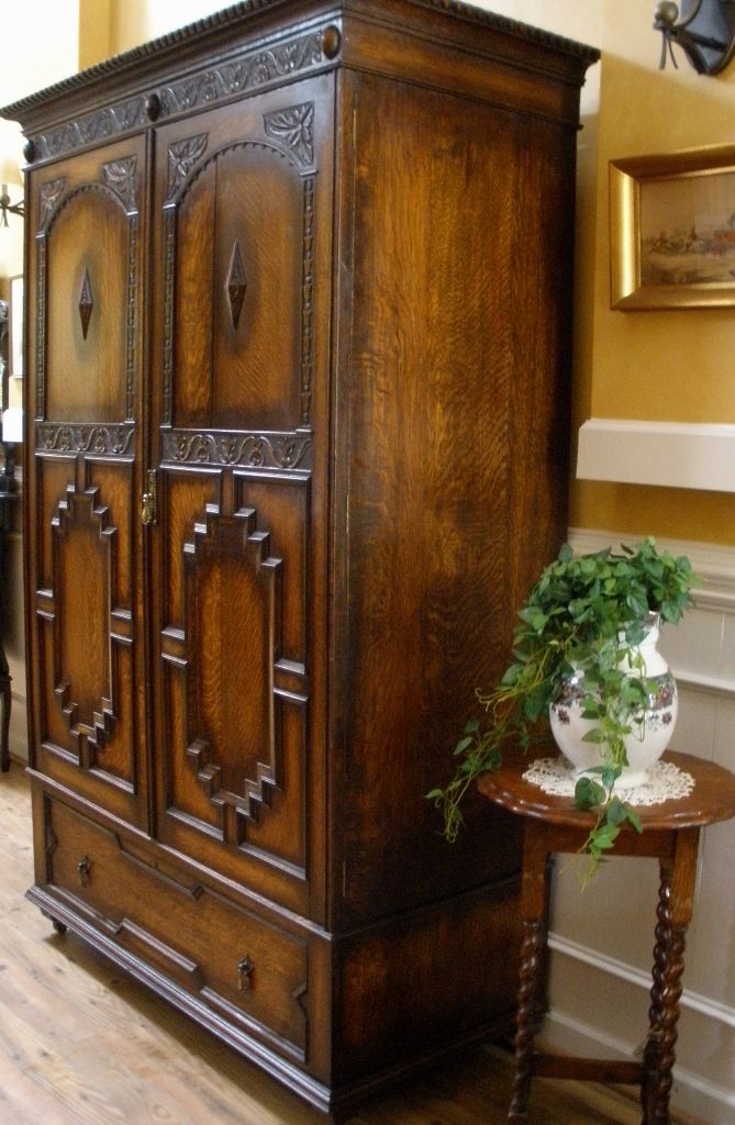 Antique English Carved Oak Jacobean Style Wardrobe Armoire. Antique English Carved Oak Jacobean Style Wardrobe Armoire.