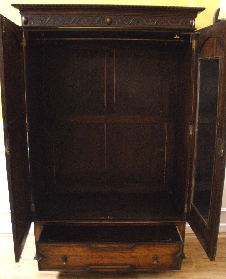 Antique English Carved Oak Jacobean Style Wardrobe Armoire. Antique English Carved Oak Jacobean Style Wardrobe Armoire.