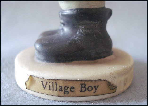 M. I. Hummel Goebel "Village Boy" Figurine - Young Boy with Basket M. I. Hummel Goebel "Village Boy" Figurine - Young Boy with Basket