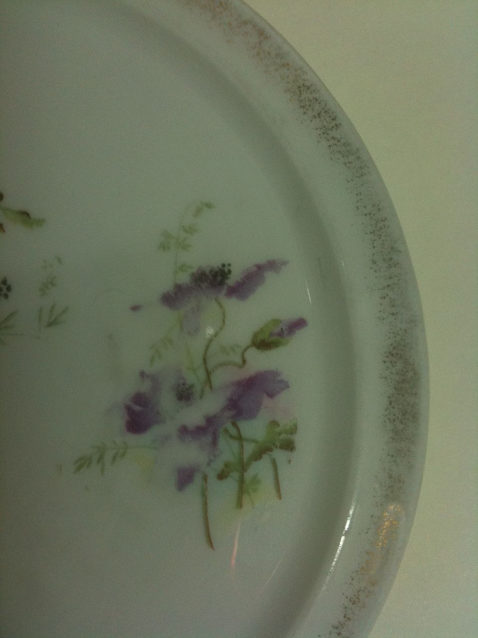 German porcelain trivet with a lavender poppy pattern German porcelain trivet with a lavender poppy pattern