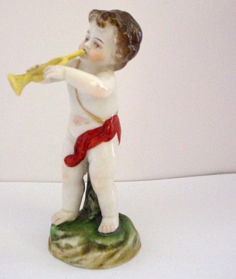 Porcelain Cabinet Figure of Putti Blowing a Horn Trumpet or Bugle Porcelain Cabinet Figure of Putti Blowing a Horn Trumpet or Bugle