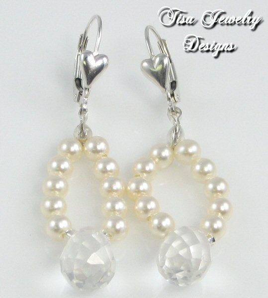 CAROL SUE EARRINGS – Swarovski crystal pearls with Swarovski faceted briolettes. Sterling silver earwires. CAROL SUE EARRINGS – Swarovski crystal pearls with Swarovski faceted briolettes. Sterling silver earwires.
