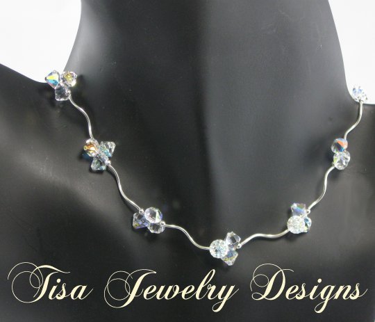 ZOE – Stunning necklace of curvy sterling silver tubes, beads and Swarovski pendant crystals ZOE – Stunning necklace of curvy sterling silver tubes, beads and Swarovski pendant crystals
