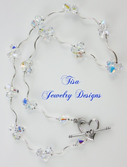 ZOE – Stunning necklace of curvy sterling silver tubes, beads and Swarovski pendant crystals ZOE – Stunning necklace of curvy sterling silver tubes, beads and Swarovski pendant crystals