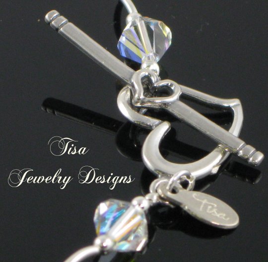 ZOE – Stunning necklace of curvy sterling silver tubes, beads and Swarovski pendant crystals ZOE – Stunning necklace of curvy sterling silver tubes, beads and Swarovski pendant crystals