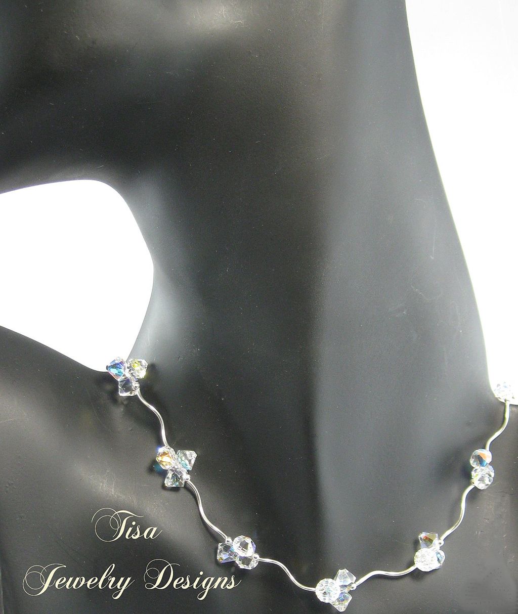 ZOE – Stunning necklace of curvy sterling silver tubes, beads and Swarovski pendant crystals ZOE – Stunning necklace of curvy sterling silver tubes, beads and Swarovski pendant crystals