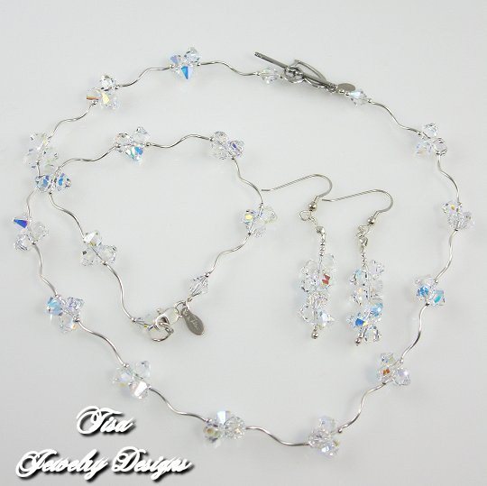 ZOE – Stunning necklace of curvy sterling silver tubes, beads and Swarovski pendant crystals ZOE – Stunning necklace of curvy sterling silver tubes, beads and Swarovski pendant crystals