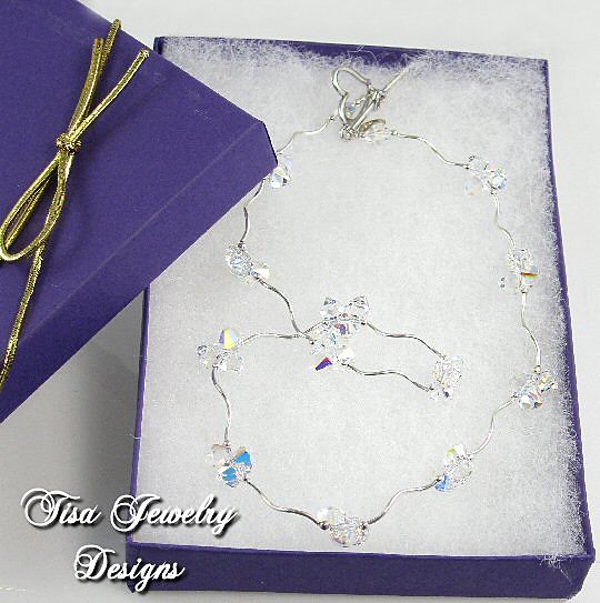 ZOE – Stunning necklace of curvy sterling silver tubes, beads and Swarovski pendant crystals ZOE – Stunning necklace of curvy sterling silver tubes, beads and Swarovski pendant crystals