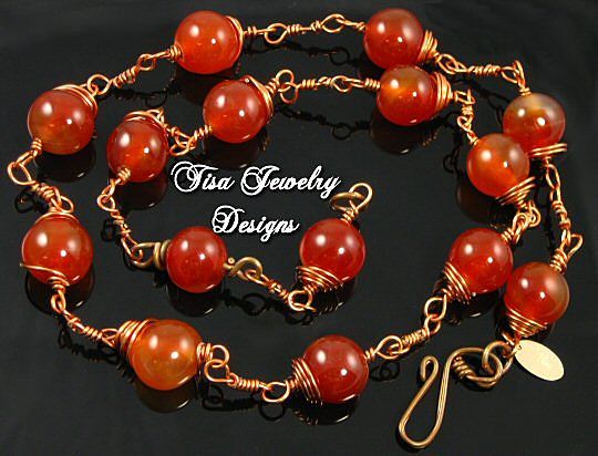 GABRIELLA – Necklace of crackle carnelian hand-wrapped in solid copper. GABRIELLA – Necklace of crackle carnelian hand-wrapped in solid copper.