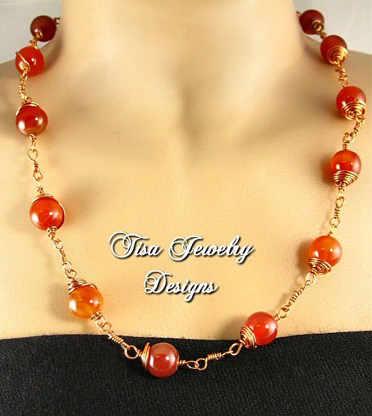 GABRIELLA – Necklace of crackle carnelian hand-wrapped in solid copper. GABRIELLA – Necklace of crackle carnelian hand-wrapped in solid copper.
