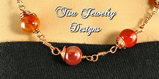 GABRIELLA – Necklace of crackle carnelian hand-wrapped in solid copper. GABRIELLA – Necklace of crackle carnelian hand-wrapped in solid copper.