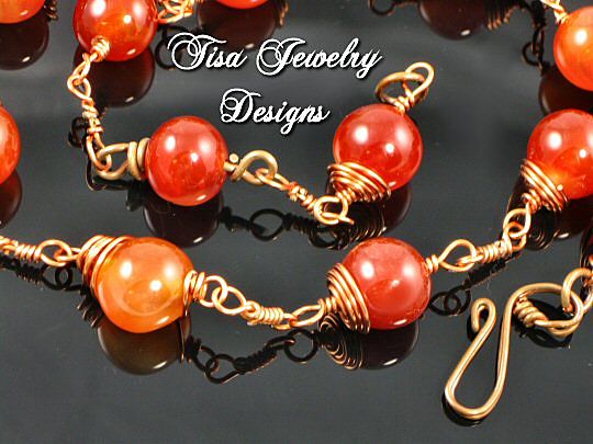 GABRIELLA – Necklace of crackle carnelian hand-wrapped in solid copper. GABRIELLA – Necklace of crackle carnelian hand-wrapped in solid copper.