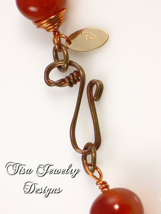 GABRIELLA – Necklace of crackle carnelian hand-wrapped in solid copper. GABRIELLA – Necklace of crackle carnelian hand-wrapped in solid copper.