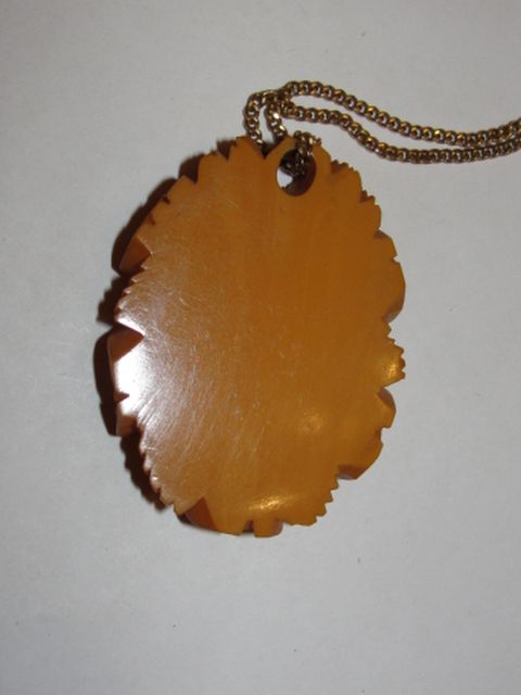 14 kt Gold Filled and Carved Bakelite Butterscotch Floral Pendant Necklace 14 kt Gold Filled and Carved Bakelite Butterscotch Floral Pendant Necklace
