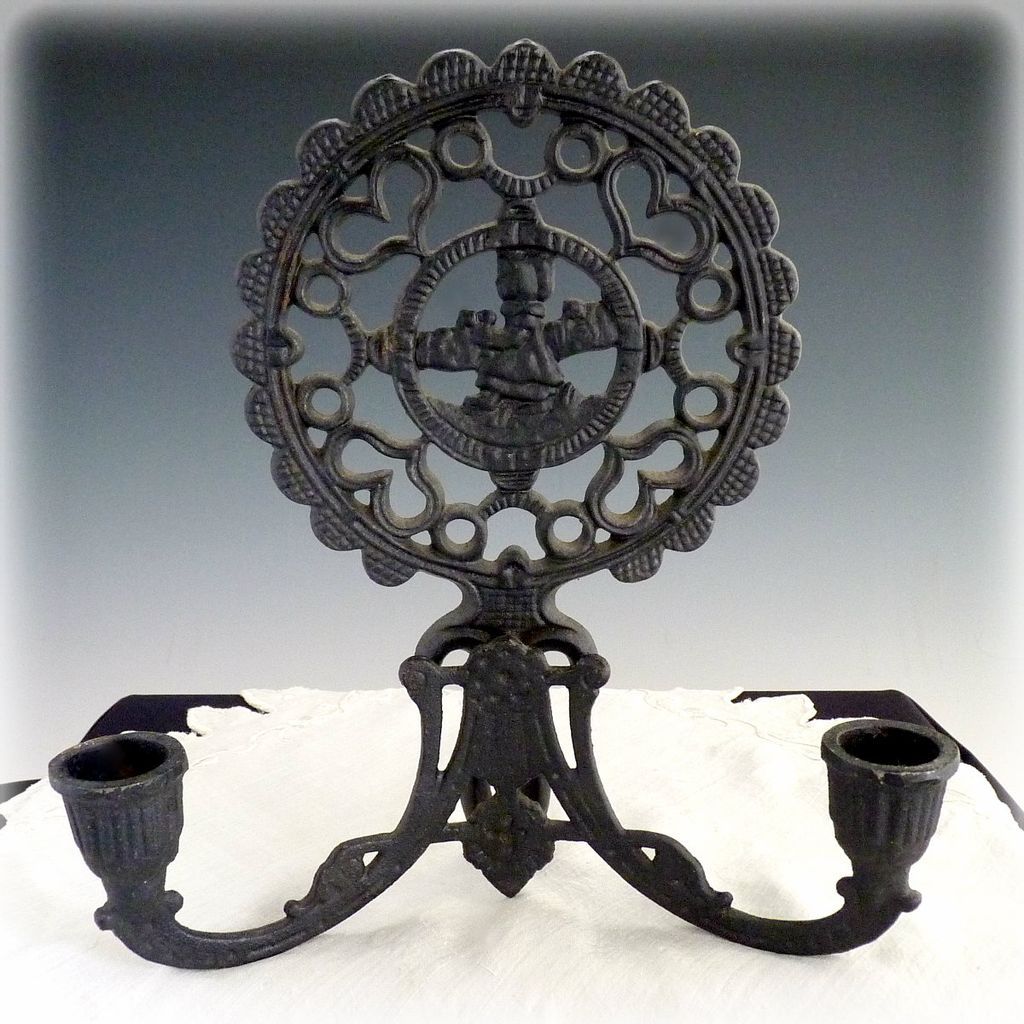 Vintage cast iron candle holders folk art hearts Vintage cast iron candle holders folk art hearts