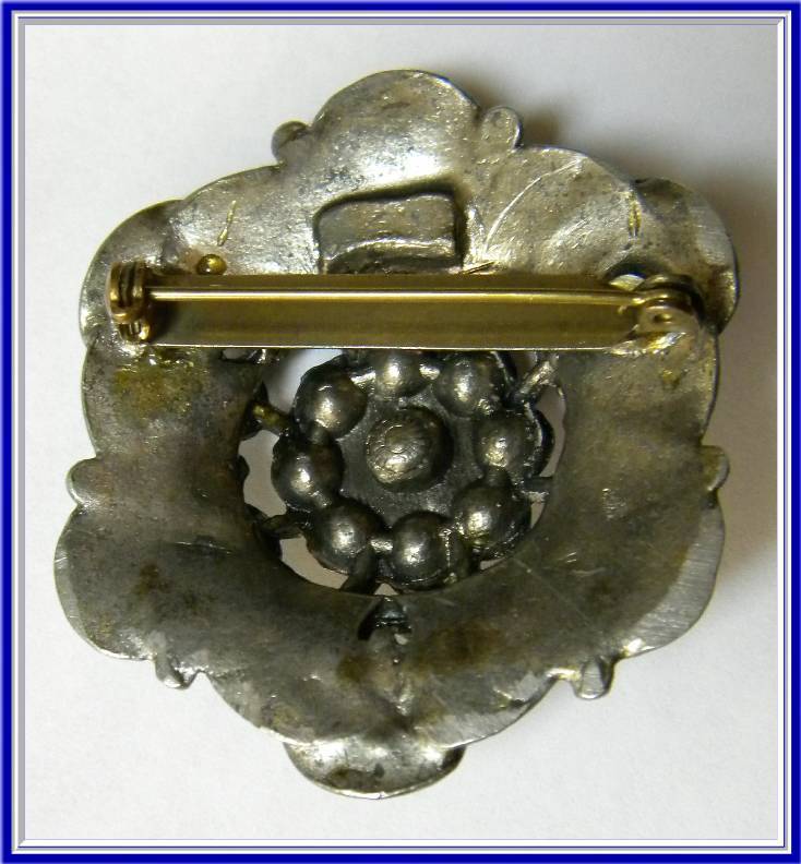 Vintage Ornately Carved Pot Metal Brooch with Multi-Cored Rhinestones Vintage Ornately Carved Pot Metal Brooch with Multi-Cored Rhinestones