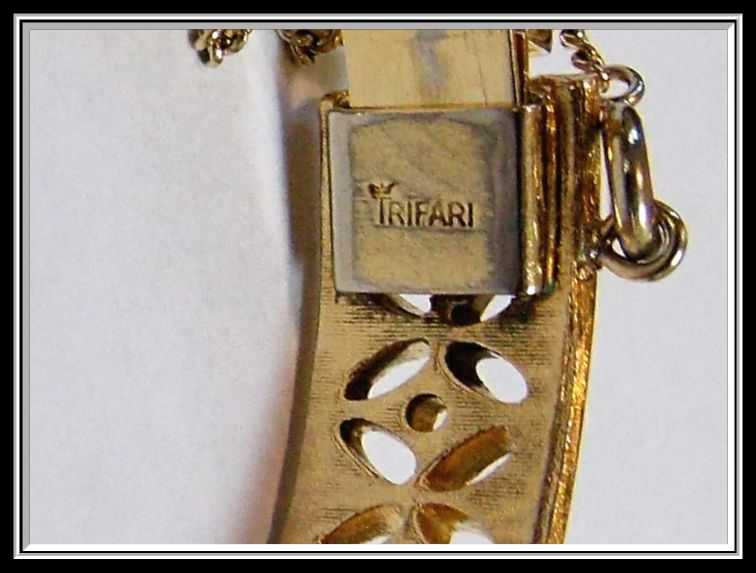 Trifari Bangle Bracelet with Safety Chain, c. 1940's Trifari Bangle Bracelet with Safety Chain, c. 1940's