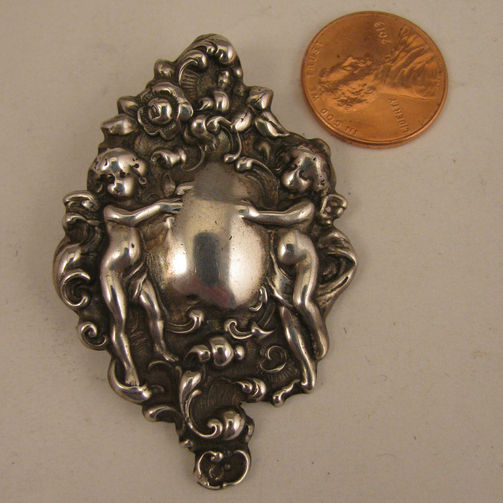 Antique Sterling Silver Cupids Pendant Antique Sterling Silver Cupids Pendant