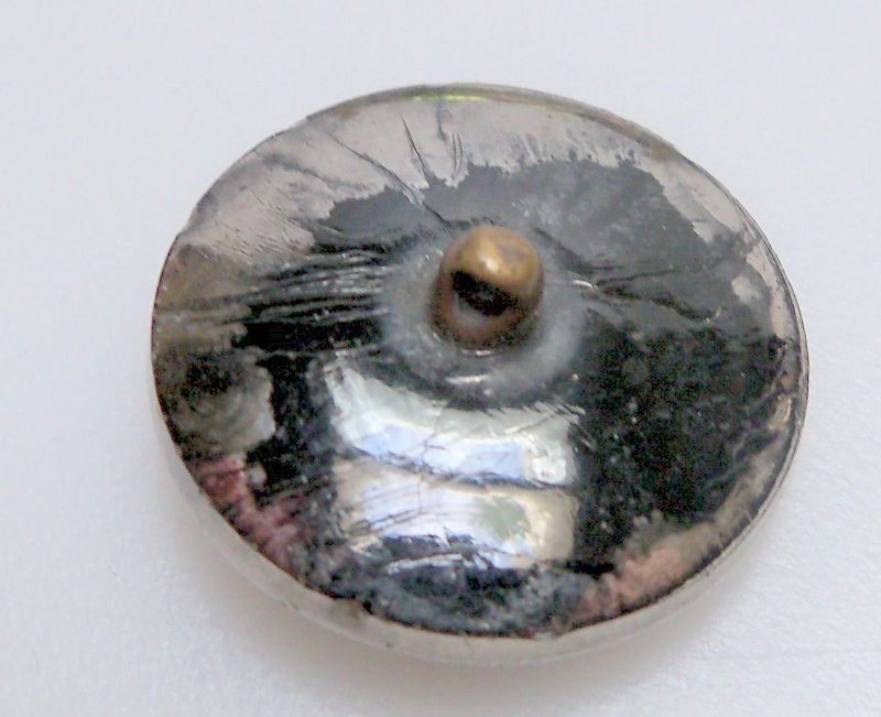 Steel Button with a faceted floral open pattern Steel Button with a faceted floral open pattern