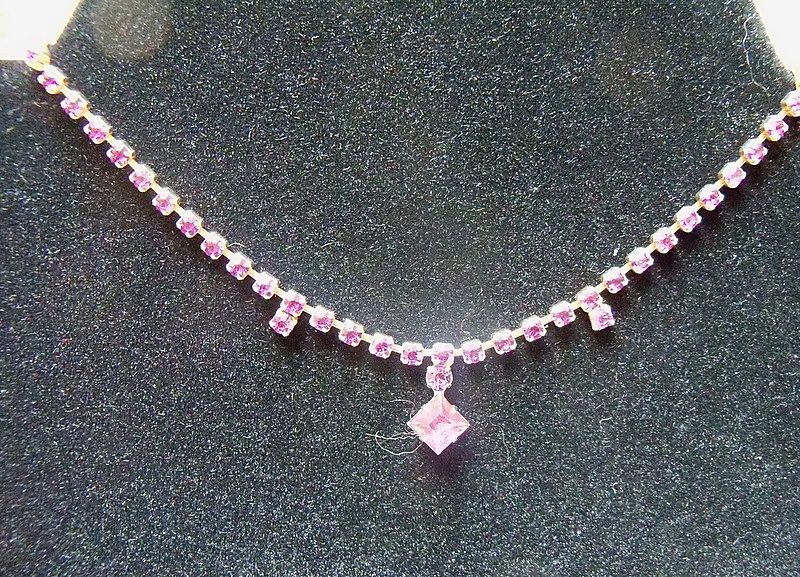 Beautiful amethyst rhinestones with a diamond shape drop necklace Beautiful amethyst rhinestones with a diamond shape drop necklace