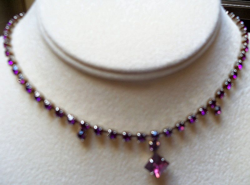 Beautiful amethyst rhinestones with a diamond shape drop necklace Beautiful amethyst rhinestones with a diamond shape drop necklace