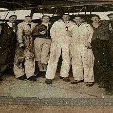 Black and White Photo of a Group of Men in front of Airplane Black and White Photo of a Group of Men in front of Airplane