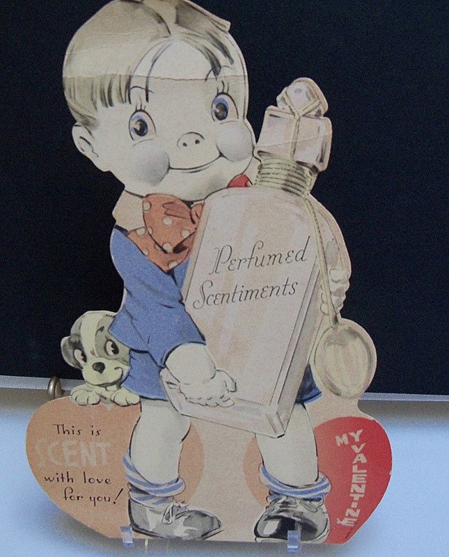Valentine Boy Holding a Perfume Bottle Valentine Boy Holding a Perfume Bottle