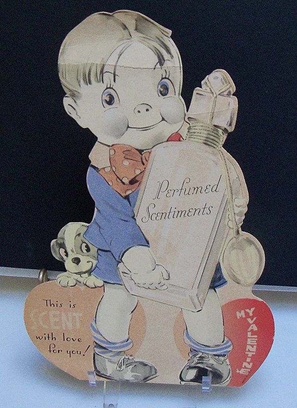 Valentine Boy Holding a Perfume Bottle Valentine Boy Holding a Perfume Bottle