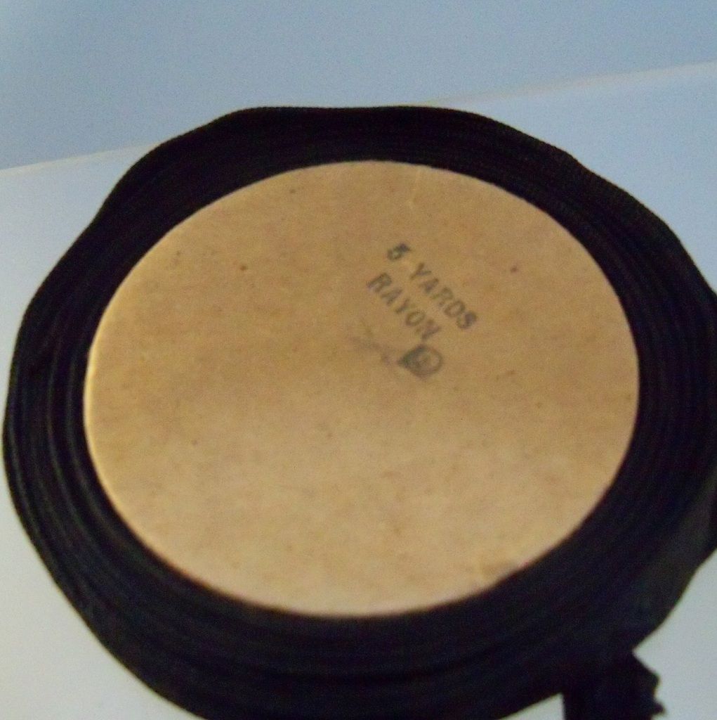 Narrow Black Moire Ribbon on cardboard spool Narrow Black Moire Ribbon on cardboard spool