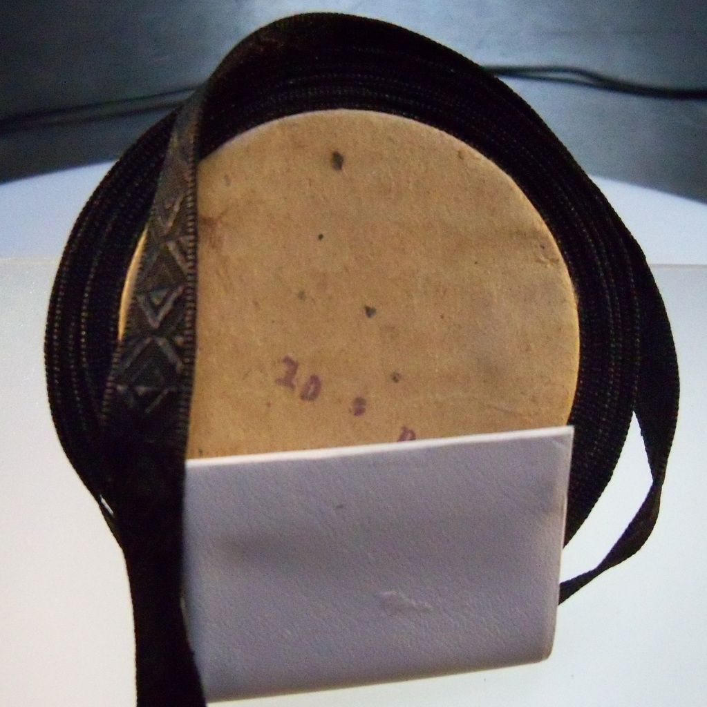 Narrow Black Moire Ribbon on cardboard spool Narrow Black Moire Ribbon on cardboard spool