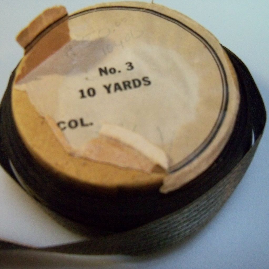 Narrow Black Moire Ribbon on cardboard spool Narrow Black Moire Ribbon on cardboard spool