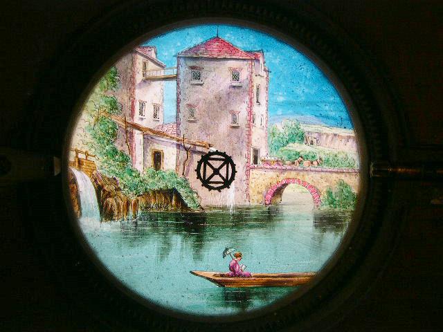 A Mid 19th C Hand Painted Moving Lantern Slide of a Watermill A Mid 19th C Hand Painted Moving Lantern Slide of a Watermill