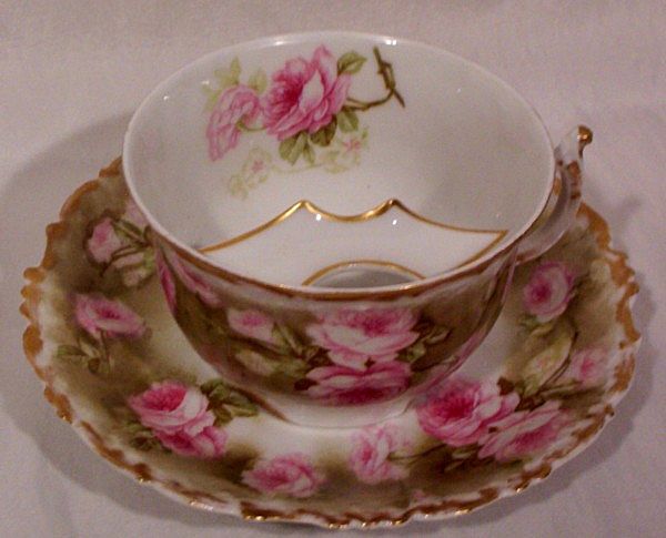 Vintage Limoges Mustache Cup and Saucer with Roses Vintage Limoges Mustache Cup and Saucer with Roses
