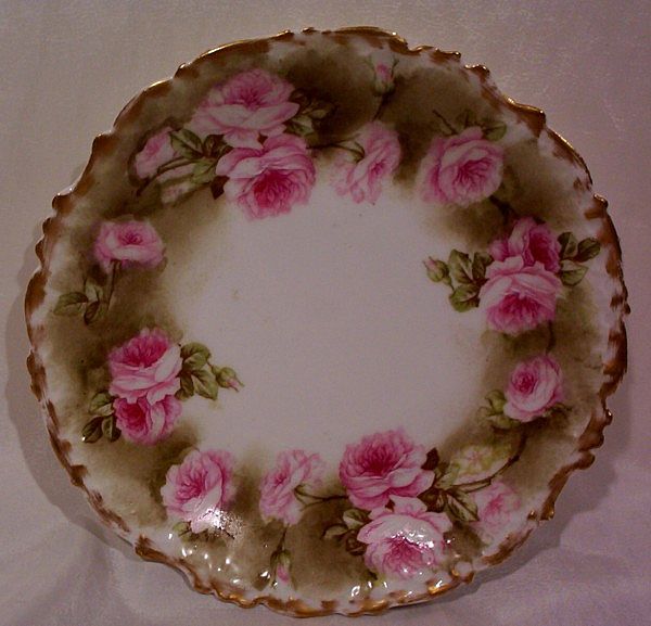 Vintage Limoges Mustache Cup and Saucer with Roses Vintage Limoges Mustache Cup and Saucer with Roses