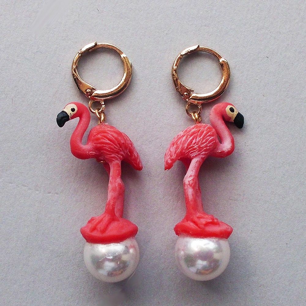 Contemporary funky earrings of rubber and glass pearl from yifataharoni