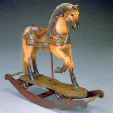 antique riding horse on wheels