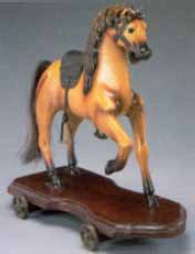 antique toy horse on wheels